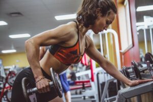 woman lifting weighs after using semaglutide weight loss injections